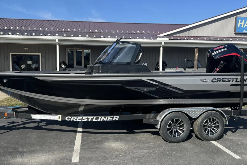 The Image of 2026 Crestliner 2050 Fish Hawk boat on trailer, parked outside a building. - 0