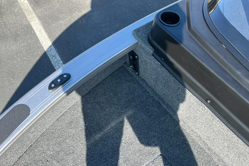 Slide: The Image of 2026 Crestliner 2050 Fish Hawk boat interior with carpeted flooring and cup holder. - 13