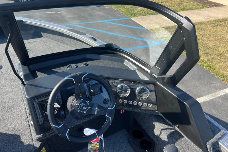 Slide: The Image of 2026 Crestliner 2050 Fish Hawk boat dashboard with steering wheel and instrument panel. - 18