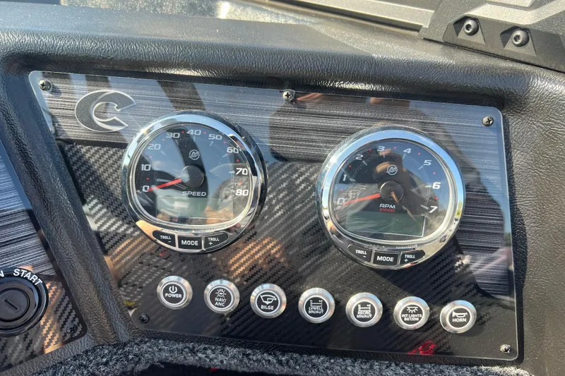 Slide: The Image of Dashboard of 2026 Crestliner 2050 Fish Hawk with speedometer and RPM gauges. - 19
