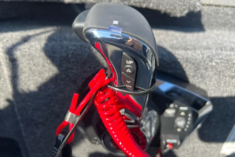 Slide: The Image of Throttle control of 2026 Crestliner 2050 Fish Hawk boat with red safety lanyard. - 21