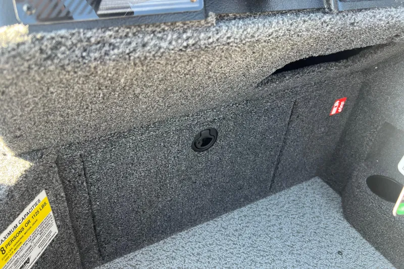 Slide: The Image of 2026 Crestliner 2050 Fish Hawk interior storage compartment with textured finish. - 24