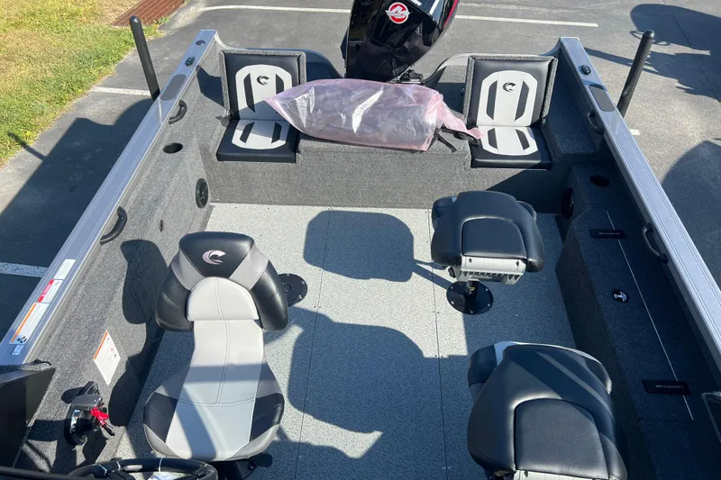 Slide: The Image of 2026 Crestliner 2050 Fish Hawk interior with seating and storage compartments. - 26