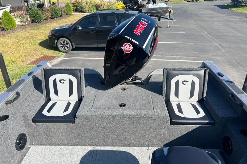 Slide: The Image of 2026 Crestliner 2050 Fish Hawk boat interior with dual seats and Mercury engine. - 31