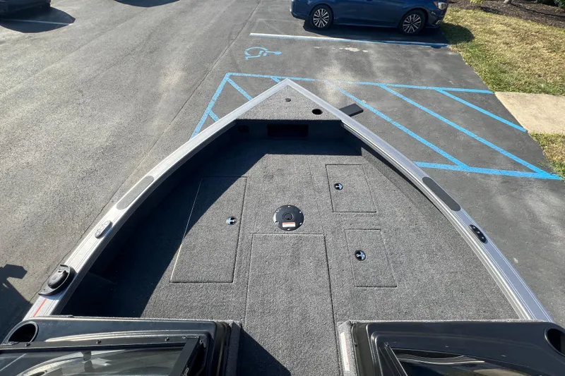 Slide: The Image of 2026 Crestliner 2050 Fish Hawk boat deck in parking lot, showcasing spacious design. - 8