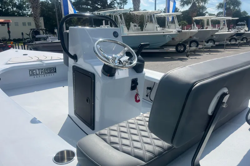 Slide: The Image of 2026 Delta Boatworks D18 boat on display, showcasing sleek design and branding. - 4