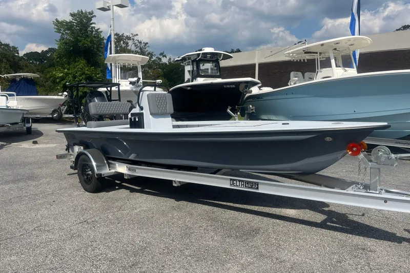The Image of 2026 Delta Boatworks D-18 on trailer at dealership, showcasing sleek design and modern features. - 0