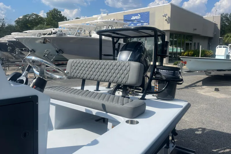 Slide: The Image of 2026 Delta Boatworks D18 interior with steering wheel and seating, displayed outdoors. - 5