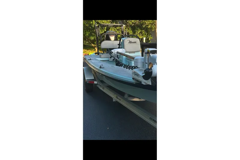 Slide: The Image of 2019 Maverick 18 HPX-V boat on trailer, parked outdoors. - 5