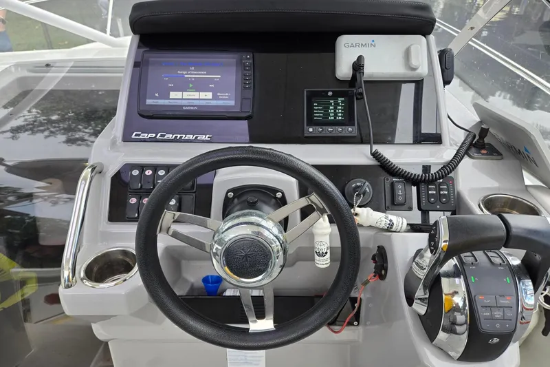 Slide: The Image of Cockpit of 2020 Jeanneau Leader 9.0 WA with Garmin navigation system and steering wheel. - 11