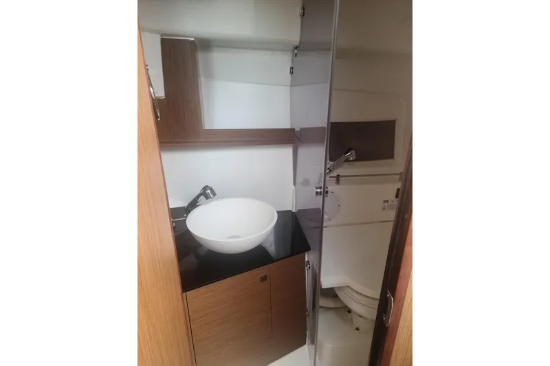 Slide: The Image of 2020 Jeanneau Leader 9.0 WA boat bathroom with sink and toilet. - 15