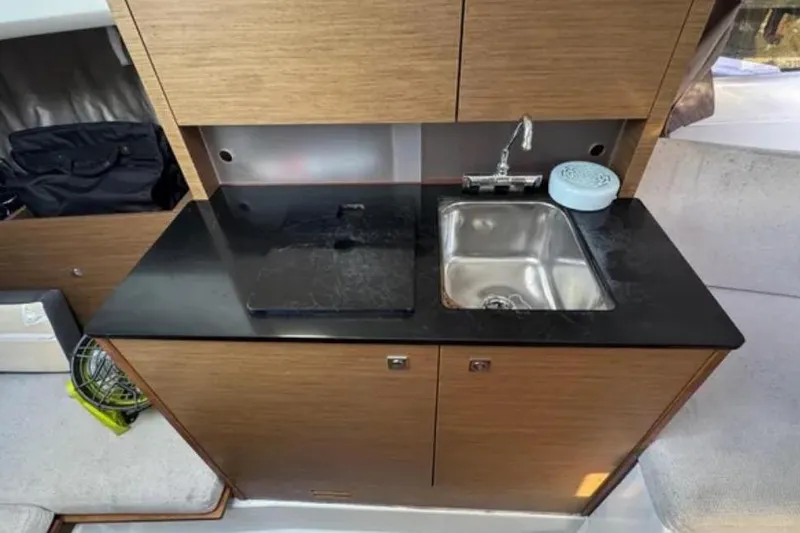 Slide: The Image of Compact kitchenette in 2020 Jeanneau Leader 9.0 WA boat with sink and countertop. - 17
