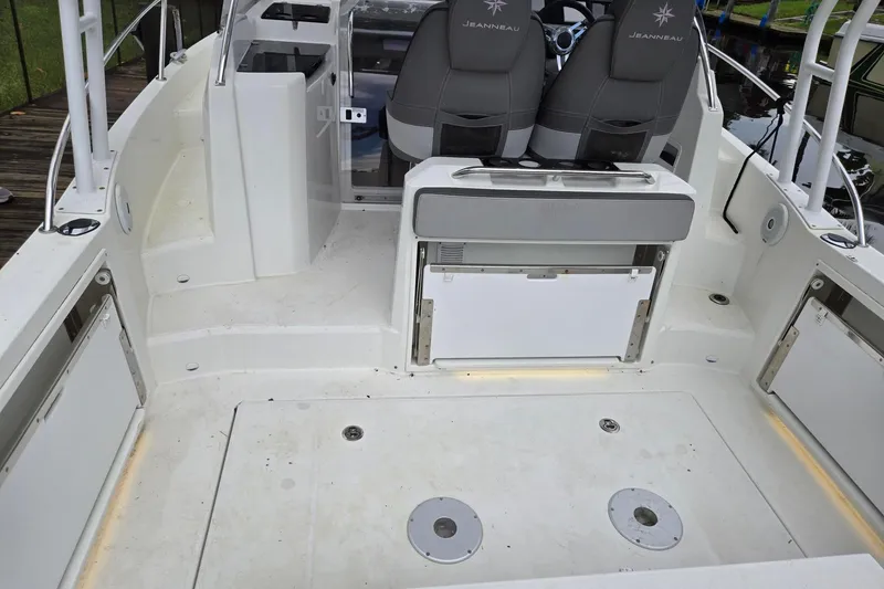 Slide: The Image of 2020 Jeanneau Leader 9.0 WA boat interior with seating and storage compartments. - 4