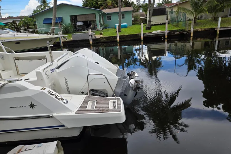 Slide: The Image of 2020 Jeanneau Leader 9.0 WA boat docked with Mercury outboard engines. - 6