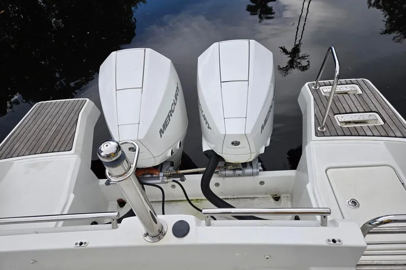 Slide: The Image of Twin Mercury outboard engines on a 2020 Jeanneau Leader 9.0 WA boat. - 9