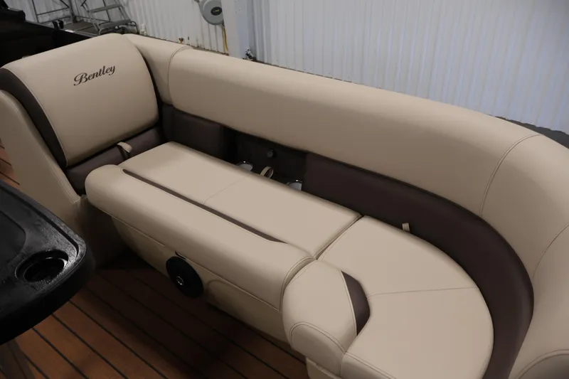 Slide: The Image of Luxurious seating on 2026 Bentley Pontoons 243 Swingback Tri-toon, featuring elegant beige upholstery. - 11