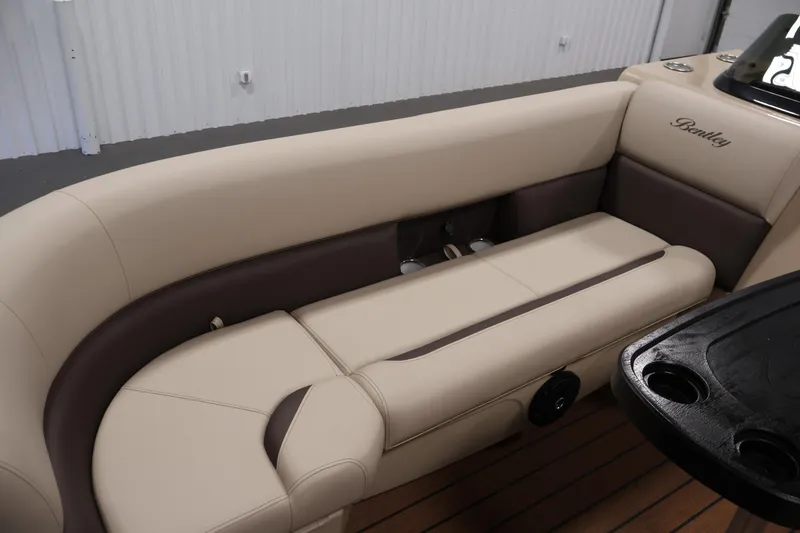 Slide: The Image of Luxurious seating in 2026 Bentley Pontoons 243 Swingback Tri-toon, featuring beige and brown upholstery. - 14
