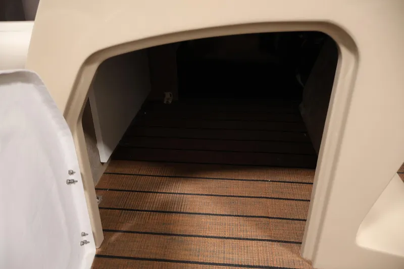 Slide: The Image of 2026 Bentley Pontoons 243 Swingback Tri-toon interior with wood-style flooring. - 18