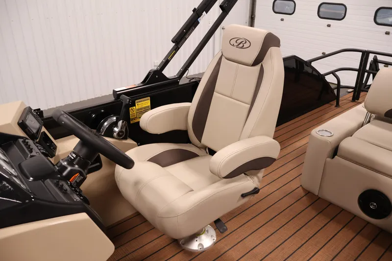 Slide: The Image of Captain's chair in 2026 Bentley Pontoons 243 Swingback Tri-toon, featuring luxurious beige upholstery. - 28