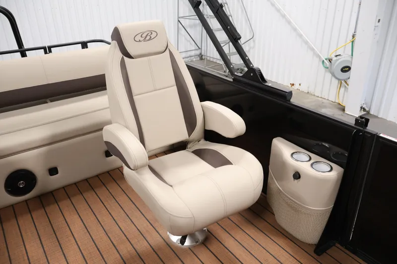 Slide: The Image of 2026 Bentley Pontoons 243 Swingback Tri-toon interior with luxurious seating and cup holders. - 29