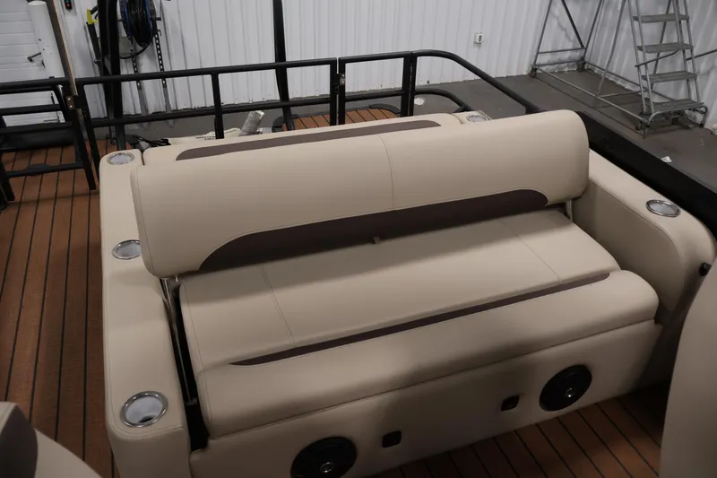Slide: The Image of 2026 Bentley Pontoons 243 Swingback Tri-toon interior with beige seating and cup holders. - 30