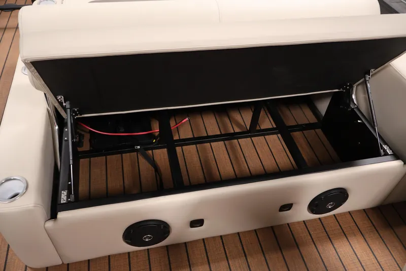 Slide: The Image of 2026 Bentley Pontoons 243 Swingback Tri-toon storage compartment with open seat and speakers. - 31