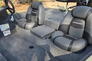 Slide: The Image of 2026 Tracker Pro Team 195 boat interior with gray seating and console. - 5