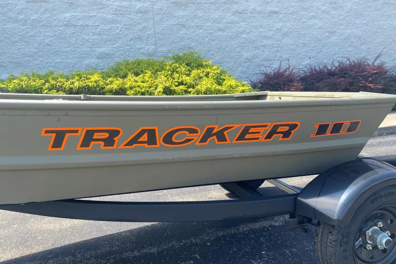 The Image of 2026 Tracker Grizzly 10 Jon boat on trailer, side view with bold lettering. - 0