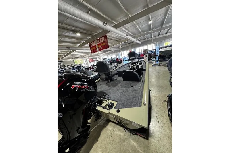 Slide: The Image of 2026 Tracker Pro Team 190 boat in showroom, featuring Mercury Pro XS engine. - 3