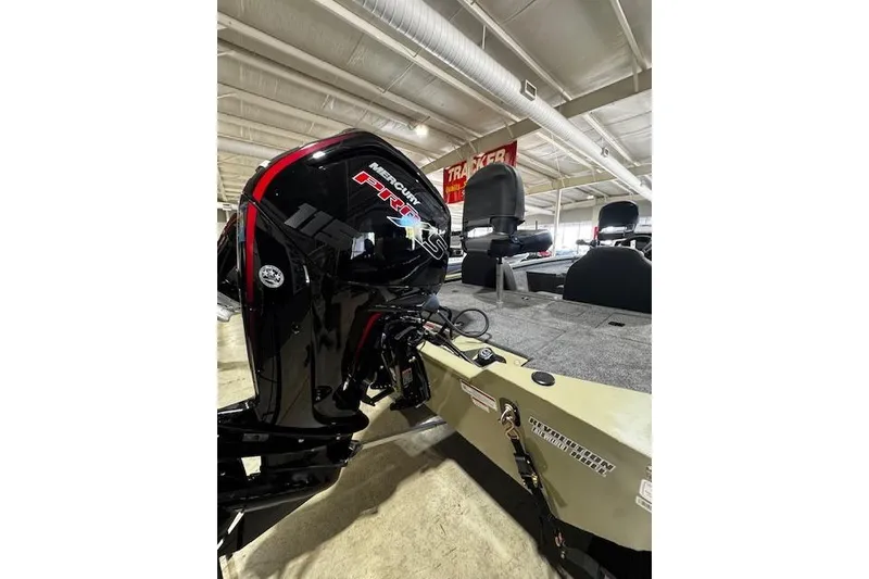 Slide: The Image of 2026 Tracker Pro Team 190 boat with Mercury Pro XS engine in showroom. - 5