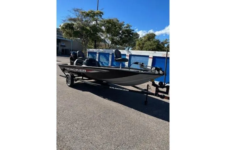 The Image of 2026 Tracker Pro Team 190 boat displayed indoors, featuring Mercury Pro XS engine. - 0