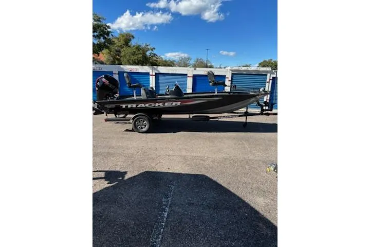 Slide: The Image of 2026 Tracker Pro Team 190 boat displayed indoors, featuring sleek design and modern seating. - 4