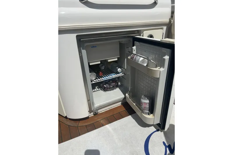 Slide: The Image of Open mini fridge on 2003 Chris-Craft Corsair 28 boat, stocked with beverages. - 15