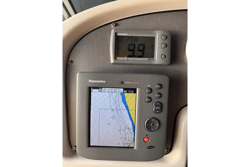 Slide: The Image of Depth and navigation instruments on a 2003 Chris-Craft Corsair 28 boat dashboard. - 6