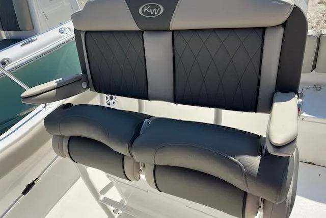 Slide: The Image of 2026 Key West 203 FS boat seating with cushioned armrests and diamond-patterned upholstery. - 3