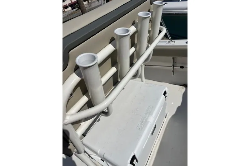 Slide: The Image of Key West 203 FS 2026 boat with rod holders and cooler on deck. - 4