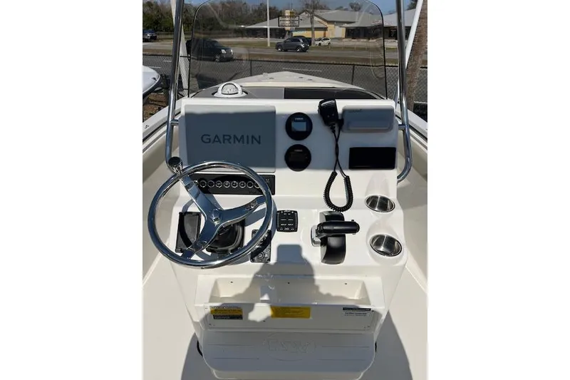 Slide: The Image of 2026 Key West 203 FS boat console with Garmin navigation system and steering wheel. - 5