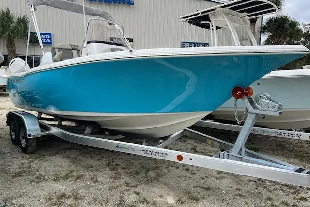 Slide: The Image of 2026 Key West 203 FS boat interior with seating and console details. - 7