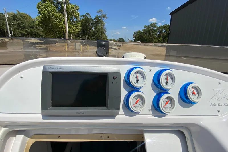 Slide: The Image of Dashboard of a 2001 Donzi ZX boat with gauges and Garmin GPS. - 10
