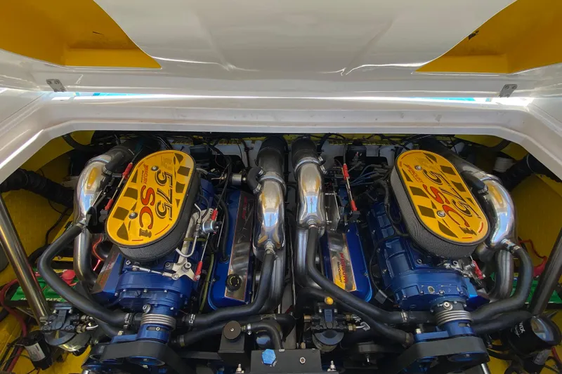 Slide: The Image of 2001 Donzi ZX engine compartment with twin 575 SCi engines, showcasing performance components. - 13