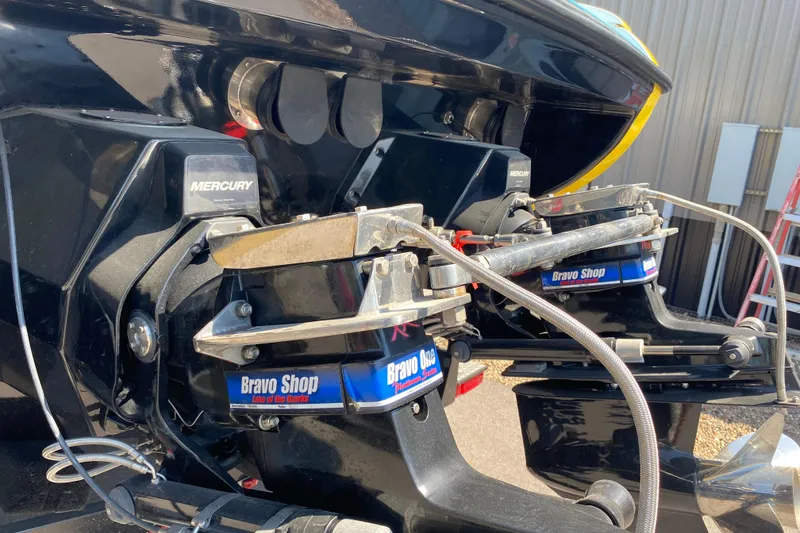 Slide: The Image of 2001 Donzi ZX boat with Mercury Bravo One outdrives in a maintenance area. - 15