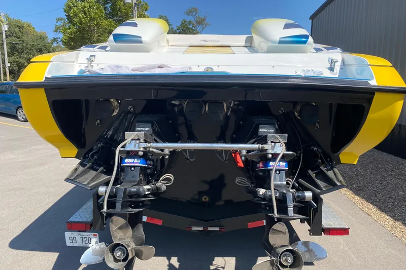 Slide: The Image of Rear view of a 2001 Donzi ZX boat with dual Mercury Bravo One engines. - 17