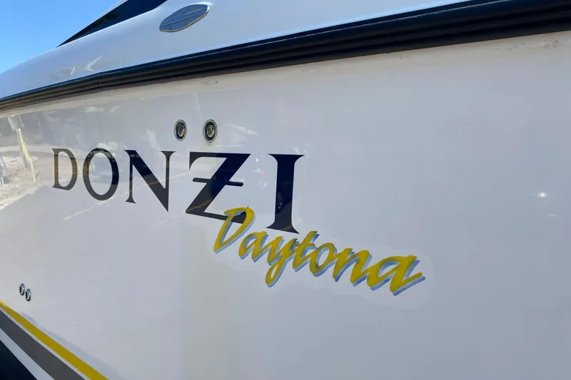 Slide: The Image of 2001 Donzi ZX Daytona boat side view with logo and branding. - 19