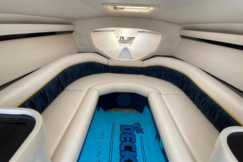 Slide: The Image of 2001 Donzi ZX boat interior with white seating and blue accents. - 26