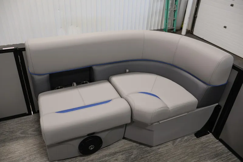 Slide: The Image of 2026 Bentley Pontoons 203 Bolt Tri-Toon interior seating with gray upholstery and blue accents. - 11