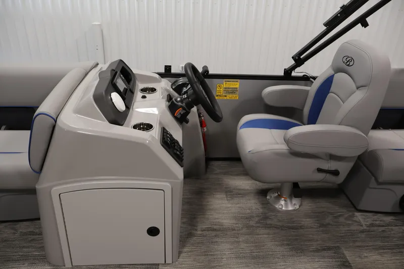 Slide: The Image of 2026 Bentley Pontoons 203 Bolt Tri-Toon interior with steering console and captain's chair. - 15