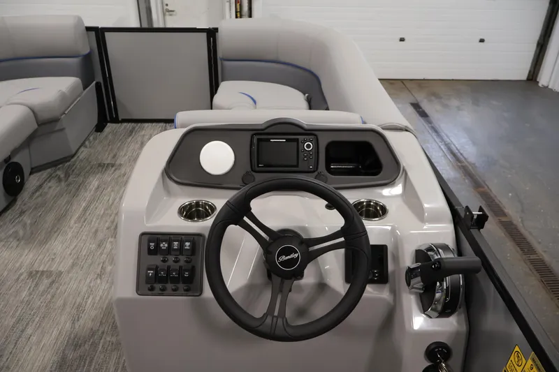 Slide: The Image of 2026 Bentley Pontoons 203 Bolt Tri-Toon interior with steering wheel and control panel. - 17