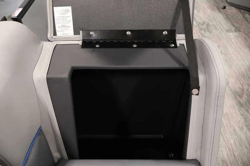 Slide: The Image of 2026 Bentley Pontoons 203 Bolt Tri-Toon storage compartment with open lid and strap. - 27