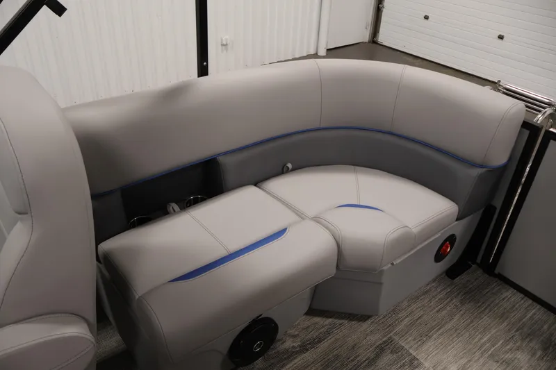 Slide: The Image of 2026 Bentley Pontoons 203 Bolt Tri-Toon interior seating with gray upholstery and blue accents. - 30