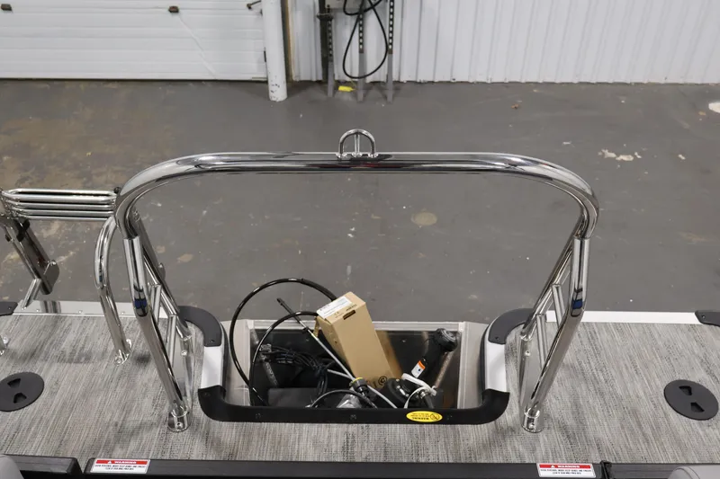Slide: The Image of 2026 Bentley Pontoons 203 Bolt Tri-Toon rear view with stainless steel railing and deck details. - 32
